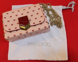 A Jimmy Choo leather sweetheart shoulder bag, pink with heart decoration with chain strap, in cloth