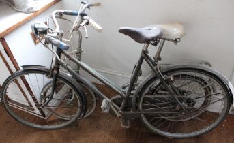 A vintage Raleigh Sports bike in original condition with a Stratton ladies bike
