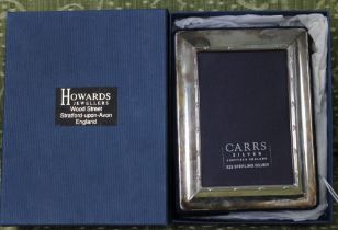 A "Carrs" silver photograph frame, bound reed design, reveal an image 8.5cm x 5.5cm, blue fabric eas