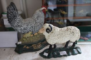 Two cast iron door-stops a sheep and a chicken