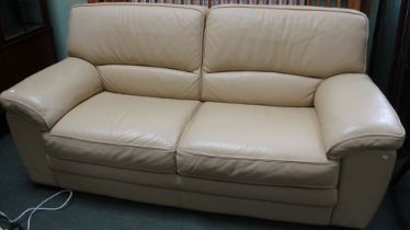 A modern cream leather three seater sofa