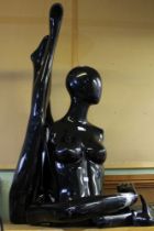 A modern black gloss female mannequin