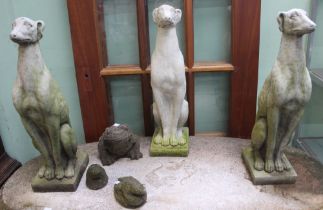 A trio of cast greyhounds, together with a trio of frogs