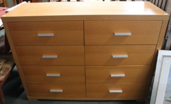 A set of modern beech chest of two banks of four drawers