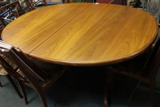 A vintage G-Plan teak oval dining table with adjustable central leaf
