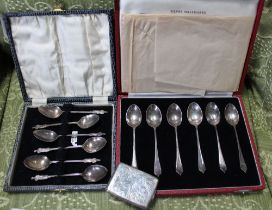 A silver matchbook holder, Birmingham 1926, together with a cased set of six silver apostle coffee s