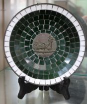 A Danish commemorative, in the form of a pewter plate, bearing a cast bronze roundel amidst mosaic d