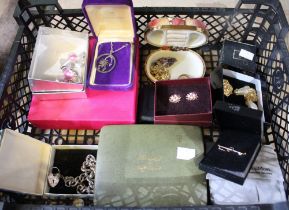 A small tray box containing a selection of jewellery, some boxed including some silver