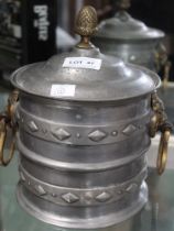 A pewter ice bucket, fitted brass Lion mask handles, with an acorn finial to the lid, touchmarks to