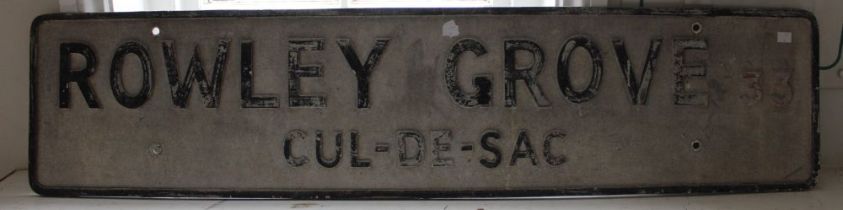 A vintage road sign for Rowley Grove