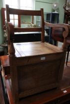 An early 20th century oak commode chair / thunder box