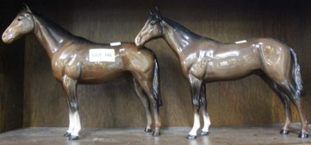 Two Beswick porcelain brown horses