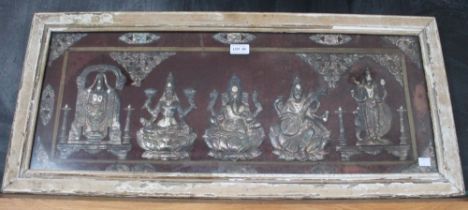 An Indian white metal frieze, depicts Ganesh to the centre, 29cm x 78cm, framed and glazed