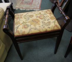 An upholstered piano stool