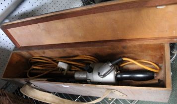A vintage Tarpentrimmer electric hedge trimmer in wooden carry box