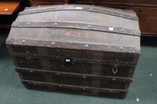 A dome top steamer trunk