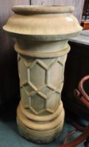 A large Victorian chimney pot with decorated central band