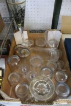 A box containing a selection of mixed glassware, various