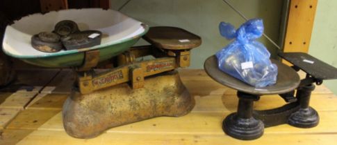 Two pairs of vintage weighing scales with weights