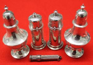 A pair of Victorian cylindrical silver pepper pots, Sheffield 1893, another pair of silver pepper po