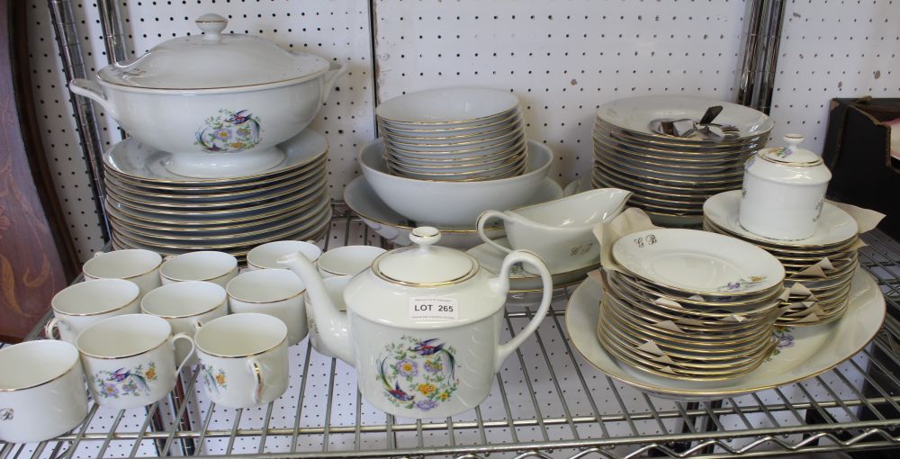 A extensive "Royal Limoges" porcelain Dinner Service, white ground with a floral and fancy bird des