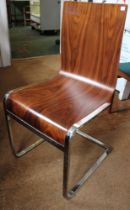 A mid century designer single chair, bent ply and chromed steel frame