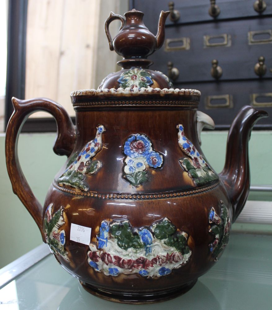 A late Victorian "Bargee" teapot, treacle glazed with applied decoration including the panel inscrib - Image 2 of 2