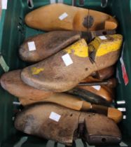 A box containing a selection of old wooden shoe lasts