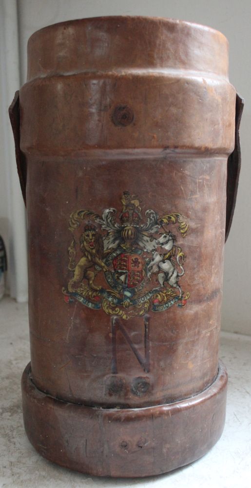 A 19th century leather powder bucket with painted crest