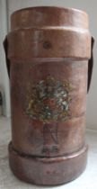 A 19th century leather powder bucket with painted crest