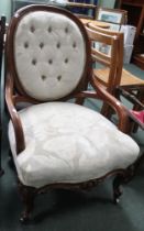 A 20th century show wood cream upholstered armchair