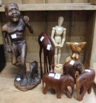 A selection of wooden figurines, human & animal examples