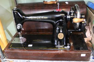 A Vintage Singer Hand Crank Sewing machine in original carrying case in good clean condition