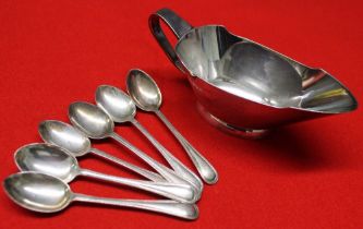 A silver sauce boat and a set of silver coffee spoons