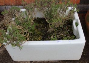 A white glazed Belfast sink garden planter