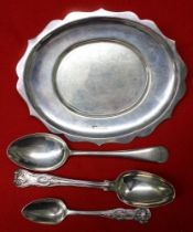 An oval silver dish and three various silver spoons, all hallmarked, combined weight 285g