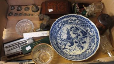 A box containing a selection of vintage collectibles to include pens, blue and white china, brass we