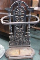 A 19th century cast iron stick/umbrella stand of small proportions with original drip tray