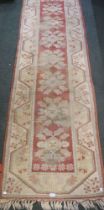 A machine woven floral geometric patterned hall runner