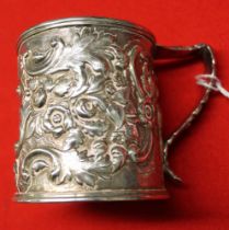 A Victorian silver christening mug, embossed floral decoration, blind cartouche, Sheffield 1853, 126