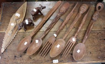 A selection of wooden African inspired spoons, forks, masks & water buffalo (9)