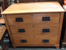 An Edwardian Satinwood chest of three drawers with period handles