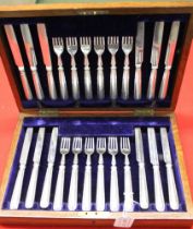 Elkington and Co, an oak canteen box of silver dessert knives and forks for twelve, Birmingham 1919