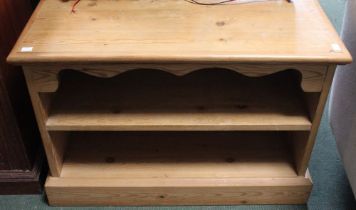A low pine two shelf AV cabinet