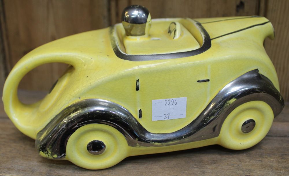 An Art Deco design sports car ceramic teapot, yellow glaze with silvered detail, number plate "OK T4 - Image 2 of 2