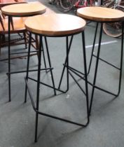 Three modern stacking metal framed bar stools with wooden seats