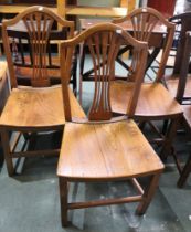 A set of four 19th century oak dining chairs in the manner of Hepplewhite