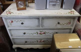 A painted chest of two over two drawers of floral design
