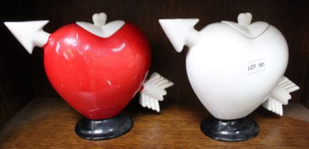 Two pottery pierced heart ceramic teapots, one painted red (2)