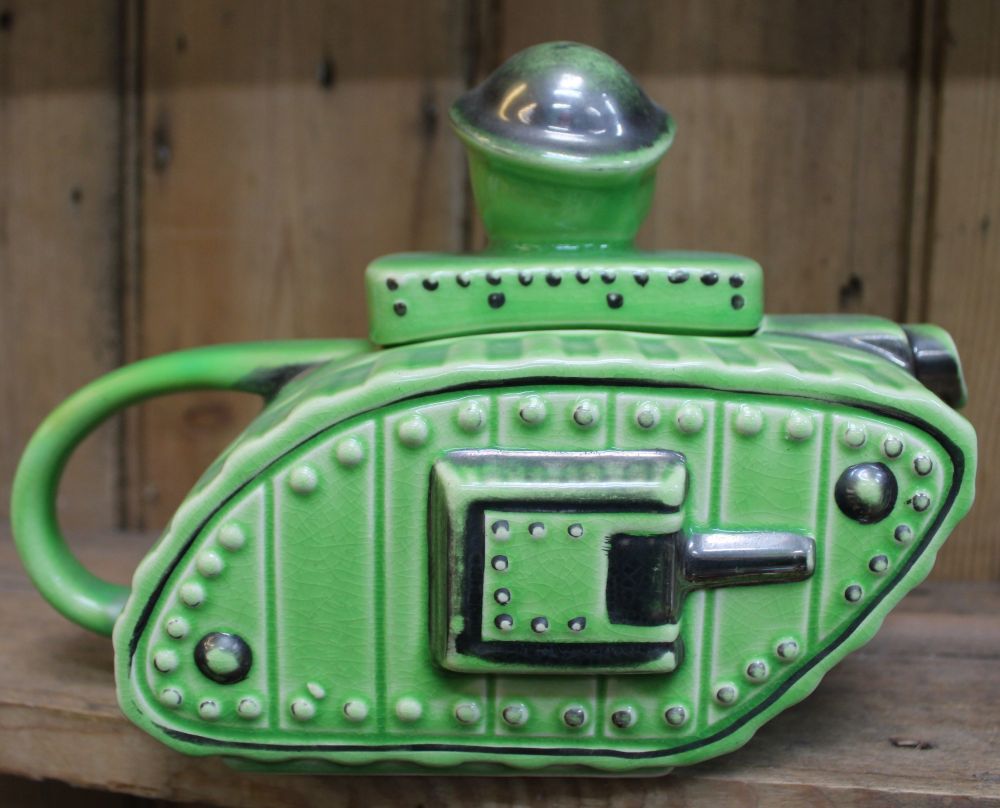 A ceramic teapot modelled as a First World War tank, the lid knop in the form of an "Old Bill" chara - Image 2 of 2